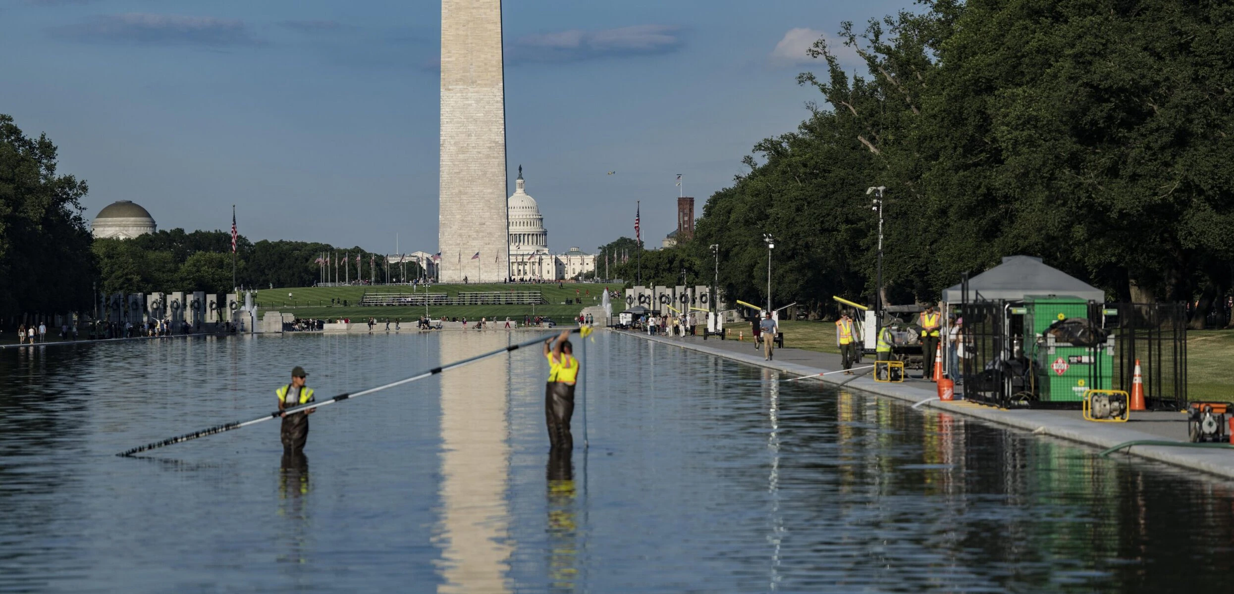 Lincoln Memorial Reflecting Pool covered in bright green algae bloom with monument visible