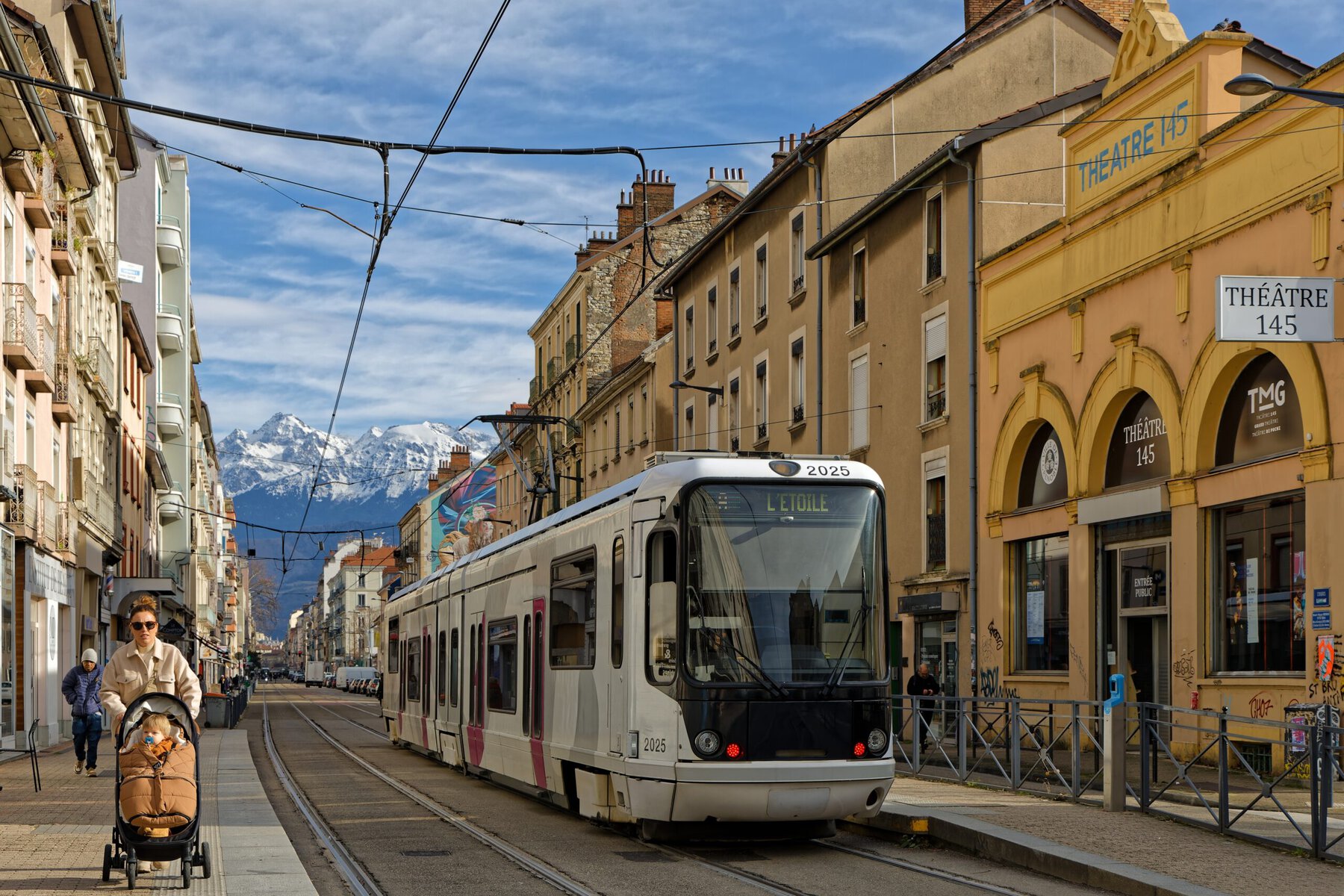 ** Tree-lined bicycle path in Grenoble, France, where advertising billboards once stood