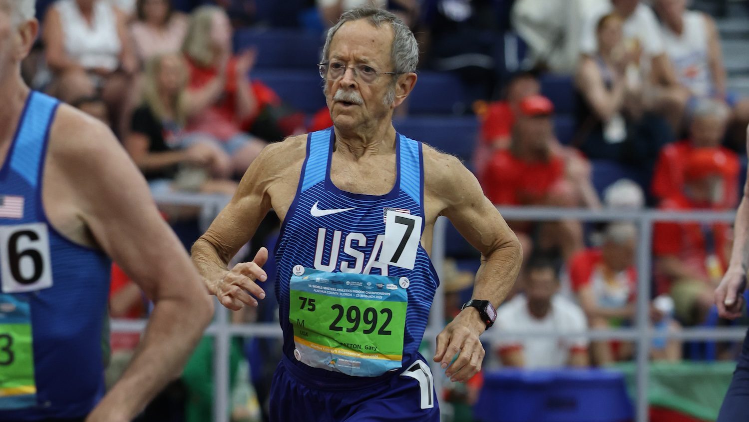 Eighty-year-old Gary Patton running on indoor track at New York City race venue