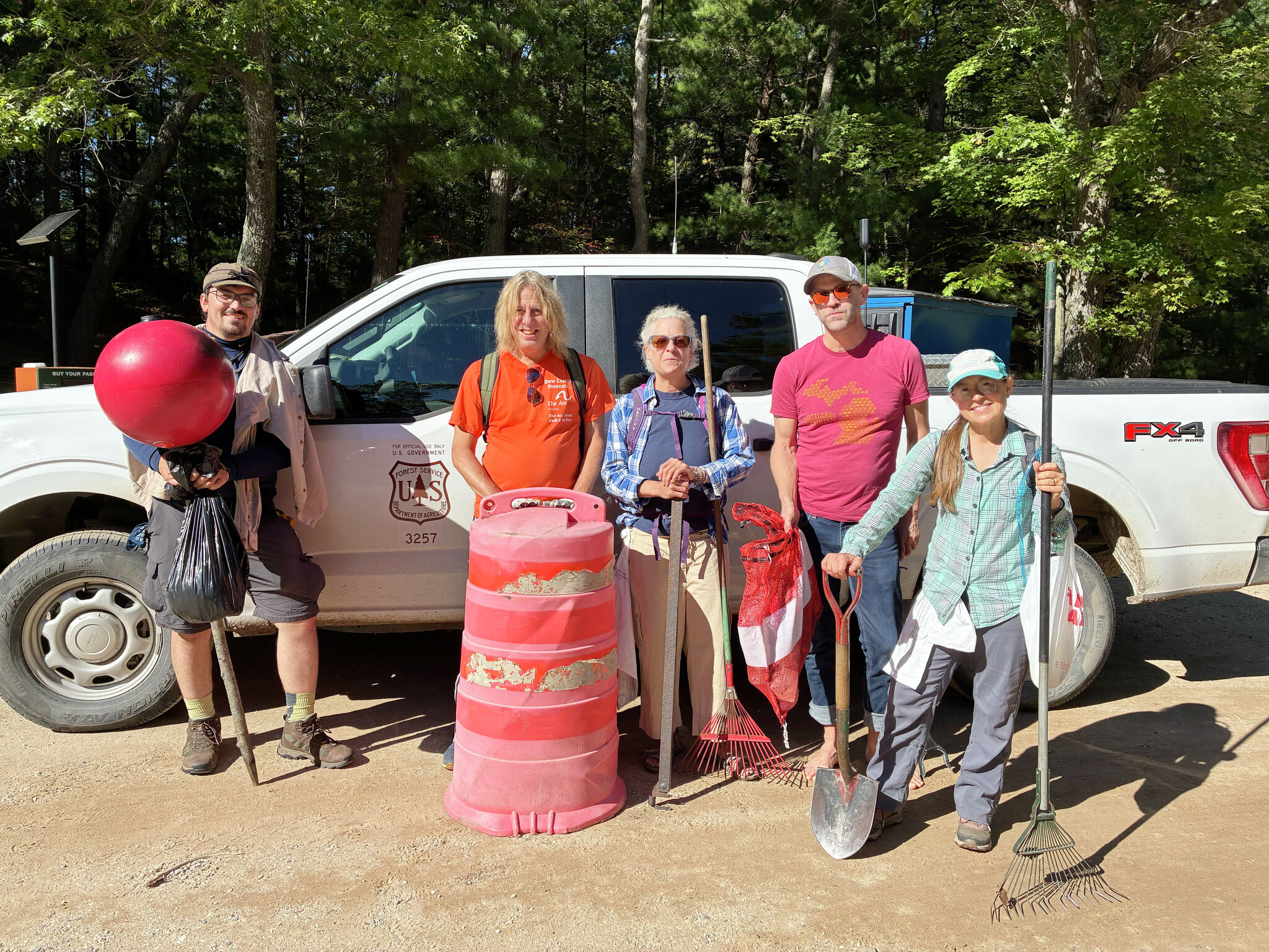 5 Volunteers Remove Traffic Barrel from Michigan Wilderness