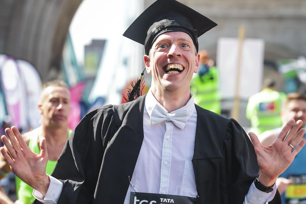 Oxford professor Alexander Betts running London Marathon wearing traditional academic gown and mortarboard