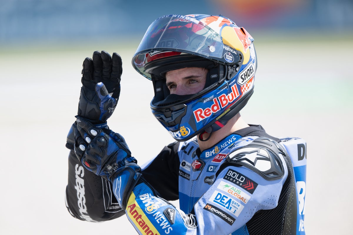 MotoGP rider Alex Marquez smiling from hospital bed after successful collarbone surgery in Barcelona