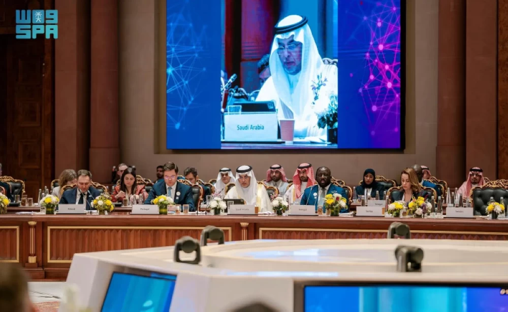 Dr. Abdullah Alghamdi speaking at podium during India AI Impact Summit in New Delhi