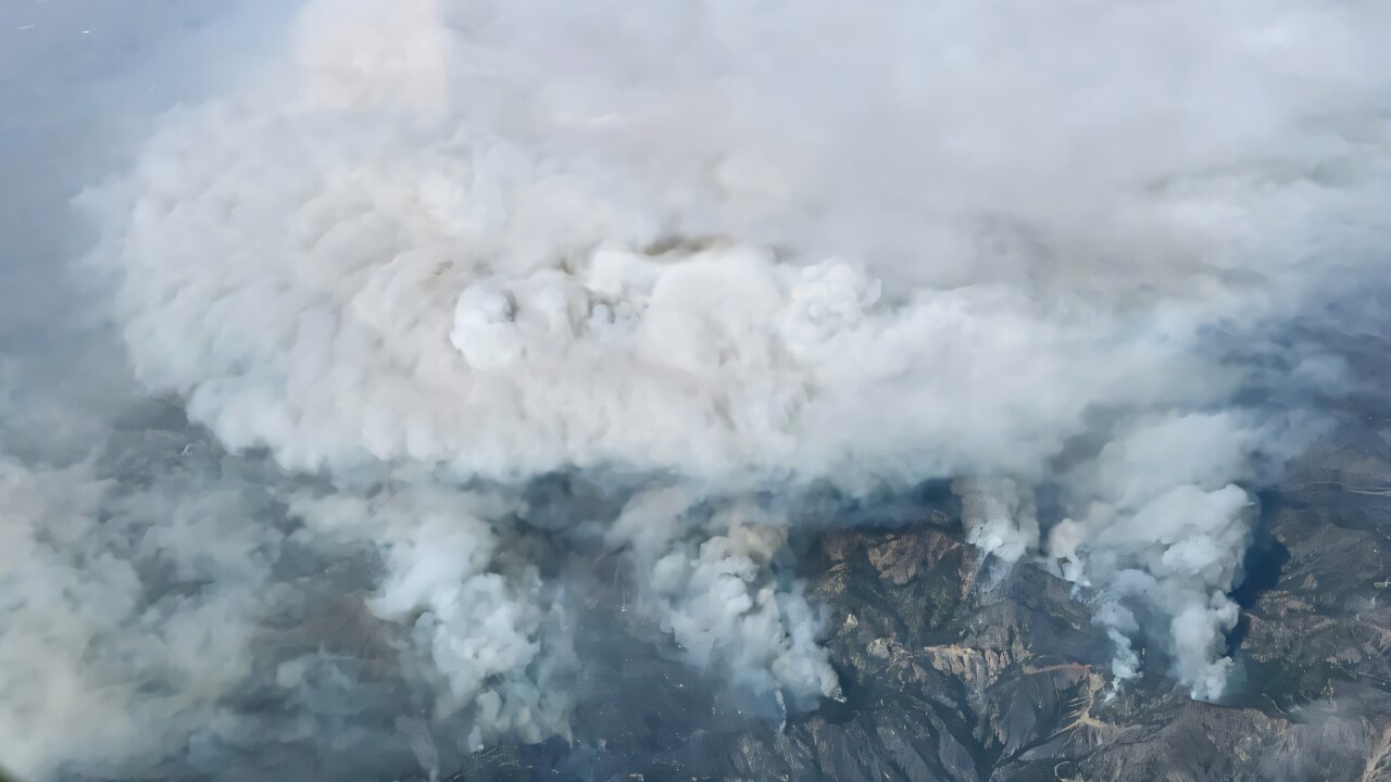 Researcher studying wildfire smoke data to develop community health protection programs
