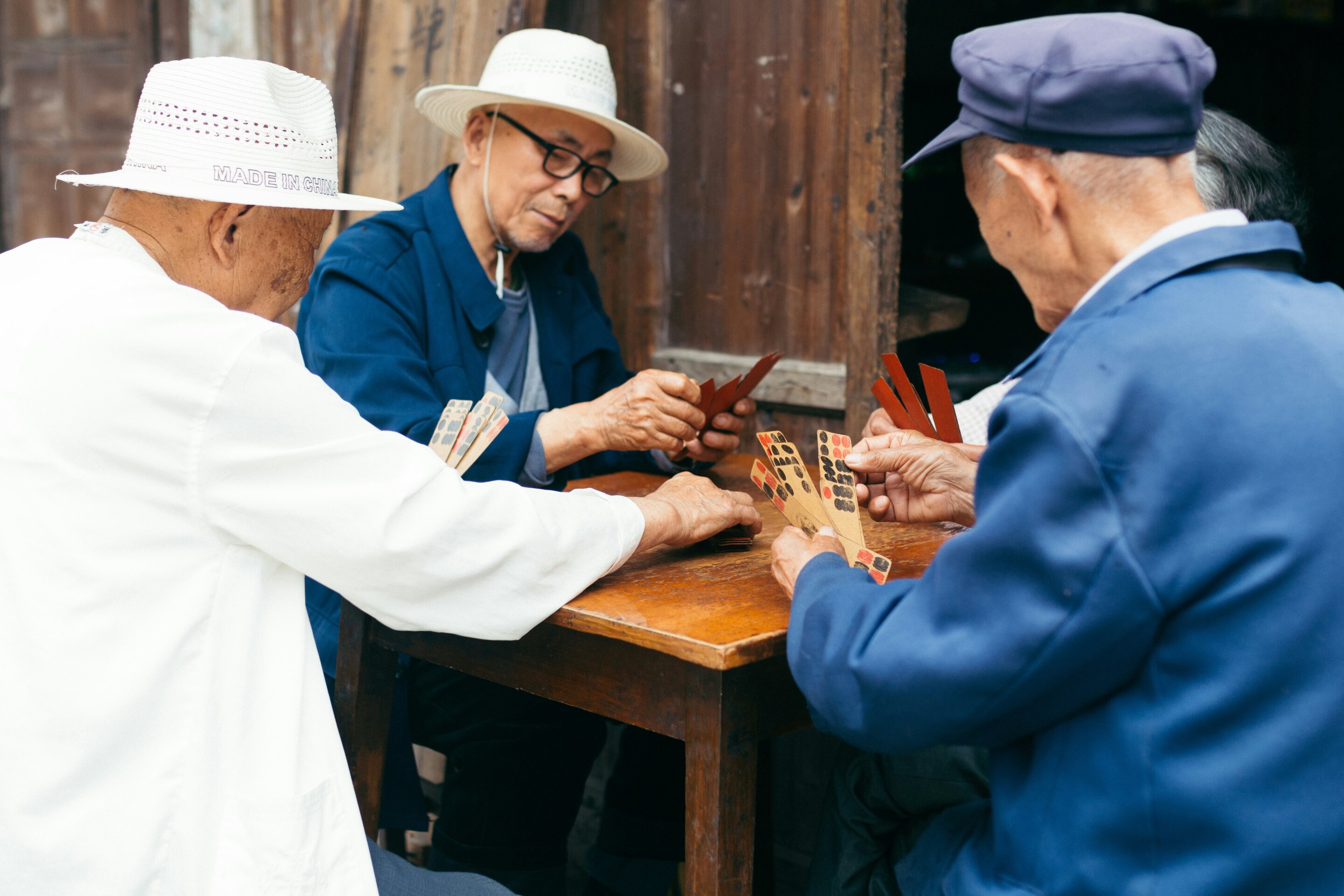 Group of senior adults walking together outdoors, smiling and enjoying conversation while exercising