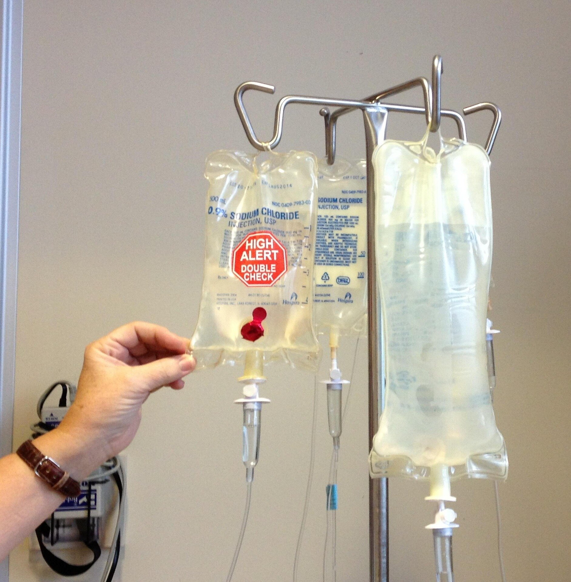 Medical professional preparing immunotherapy treatment in a bright hospital room during morning hours