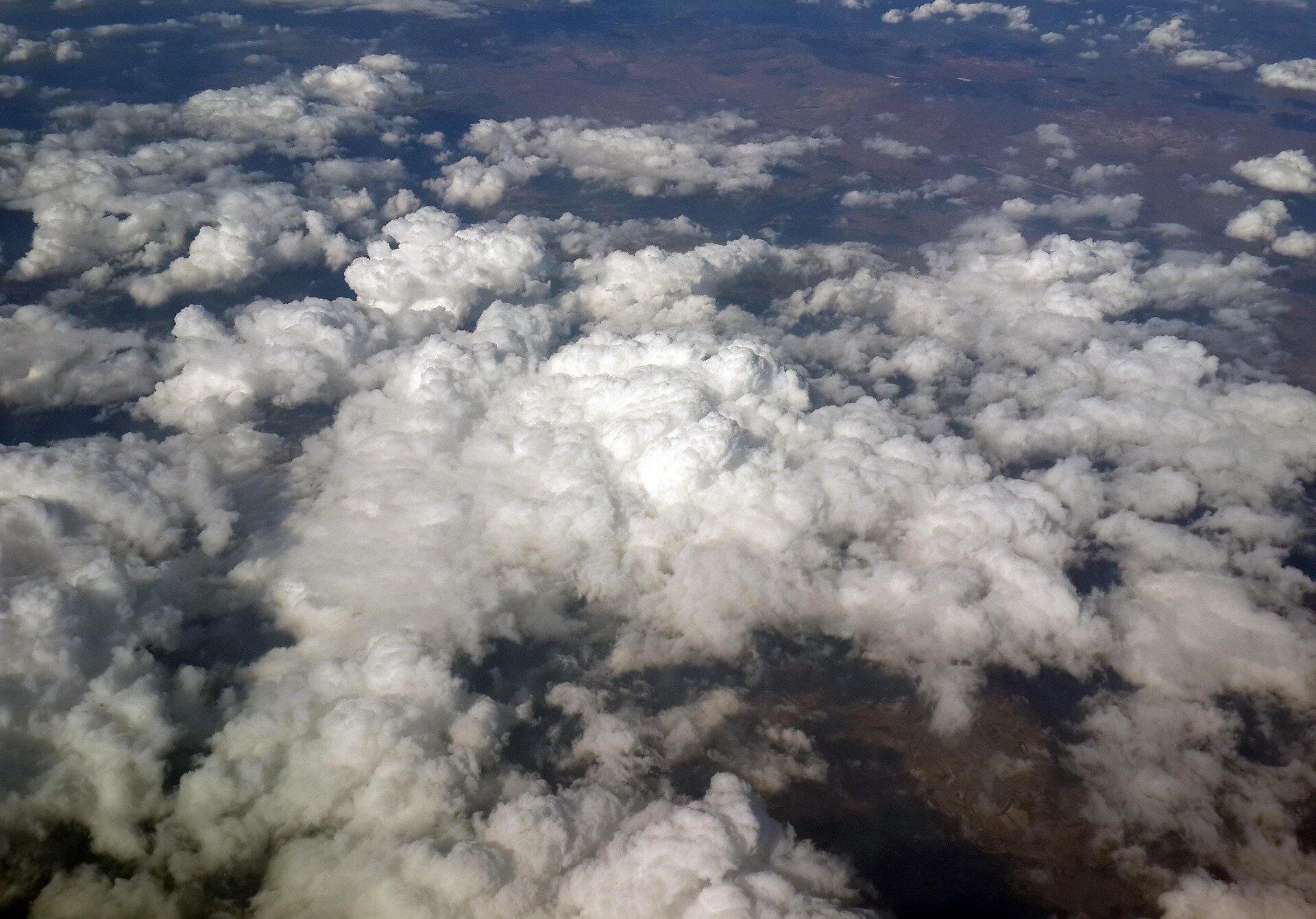 Satellite view of Earth showing clear land surface after cloud removal by AI technology