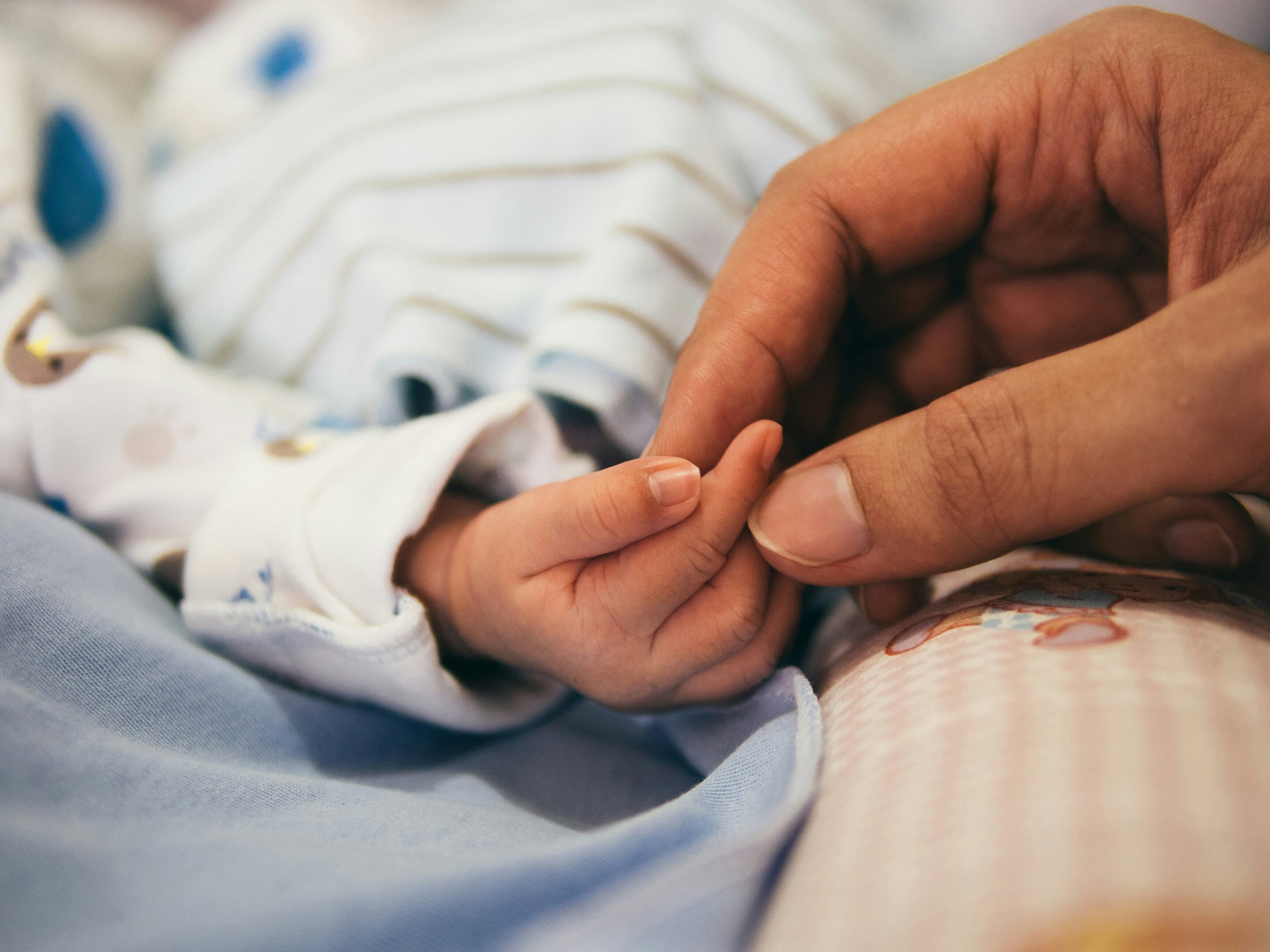 Pregnant woman receiving supportive care and counseling from trained recovery doula specialist