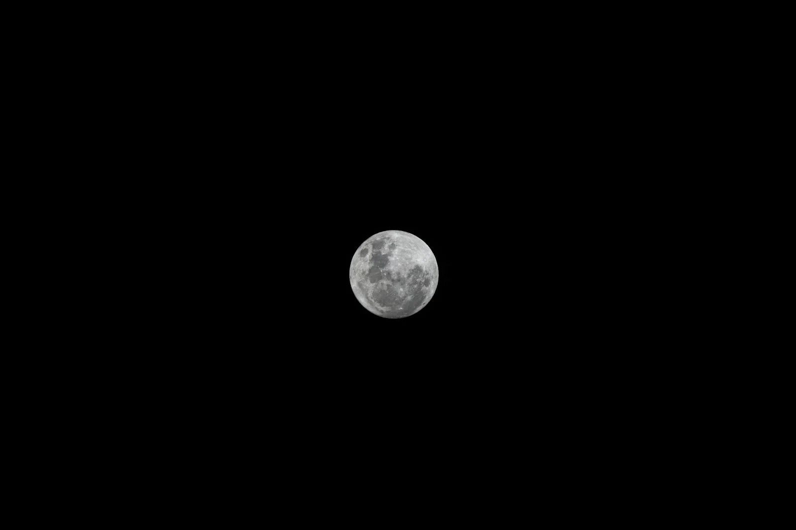 Grainy black and white photograph showing the far side of the Moon taken by Soviet Luna 3 probe