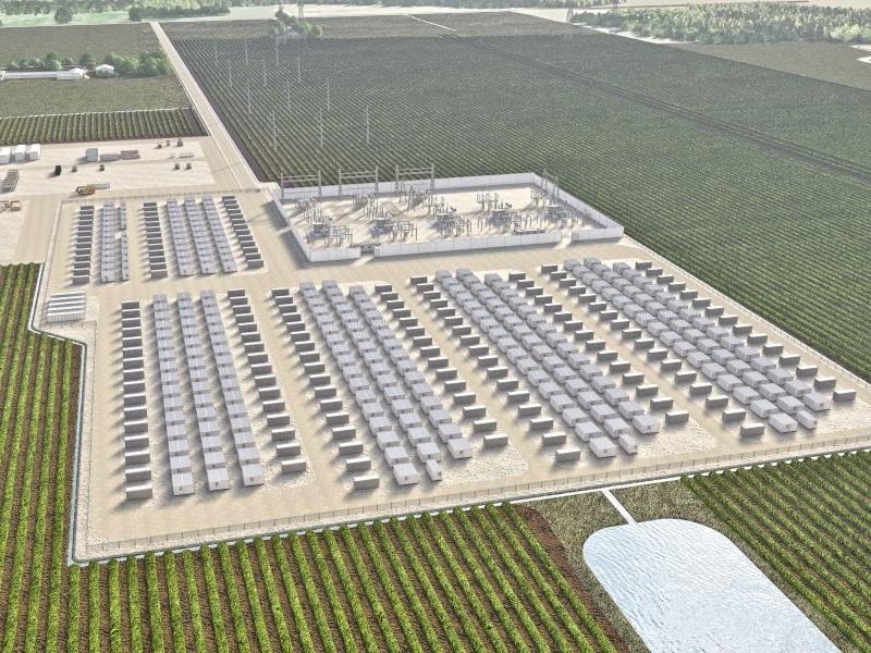 Large-scale battery energy storage facility with rows of white storage units under blue sky