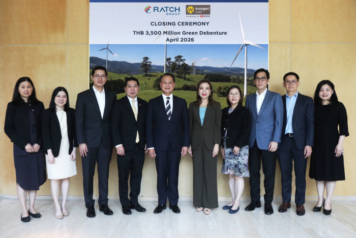 Wind turbines spinning against blue sky generating clean renewable energy in Thailand