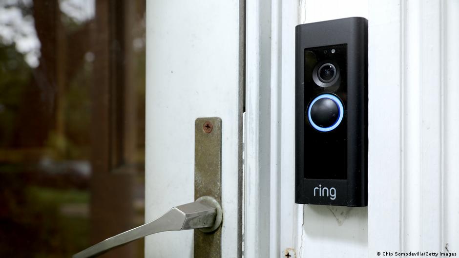 Ring video doorbell camera mounted on home exterior wall near front door
