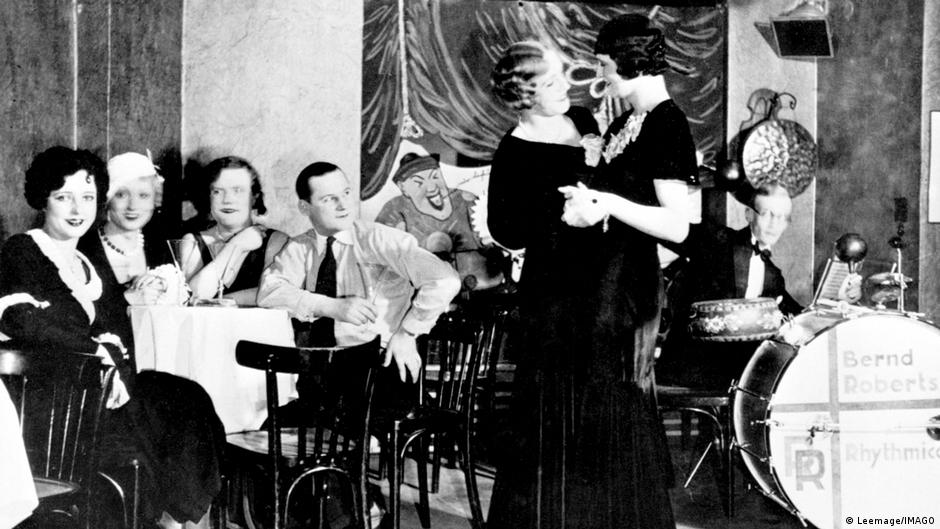 ** Black and white photograph of patrons gathered inside Eldorado nightclub in 1920s Berlin