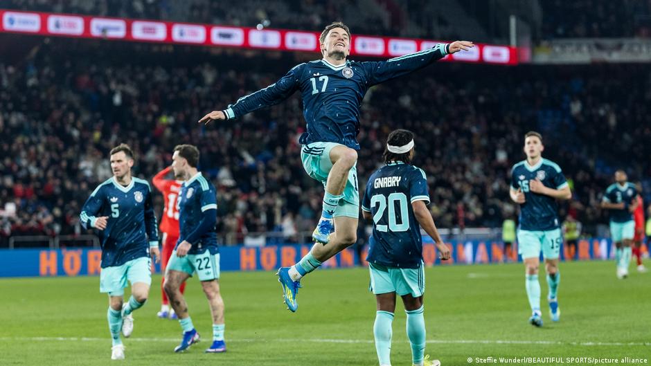 Florian Wirtz leaps in the air celebrating during Germany's thrilling match against Switzerland