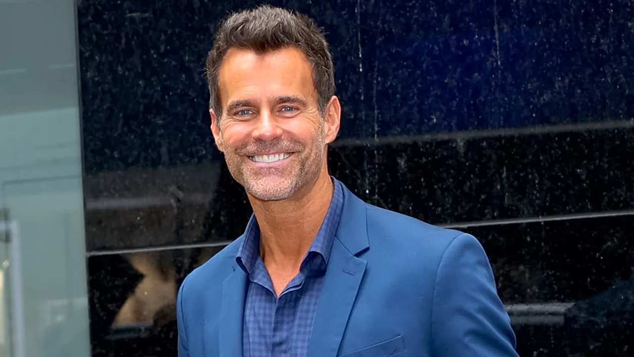 Actor Cameron Mathison smiling at red carpet event, celebrating six years cancer free