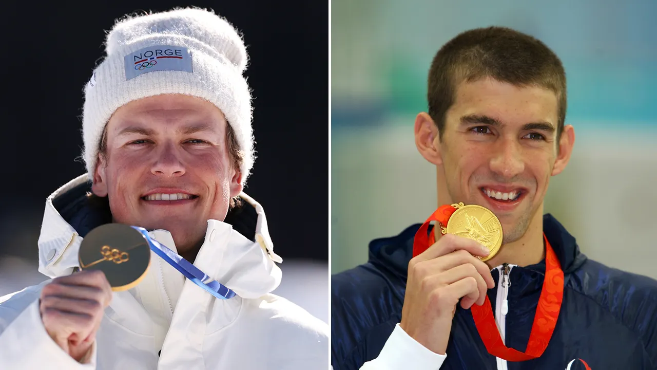 Johannes Hoesflot Klaebo celebrating with Norwegian flag after winning cross country skiing gold medal