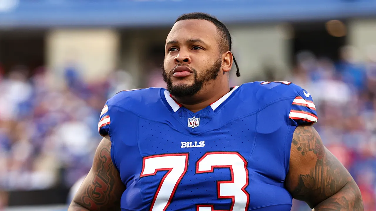 Buffalo Bills left tackle Dion Dawkins and quarterback Josh Allen on the football field together