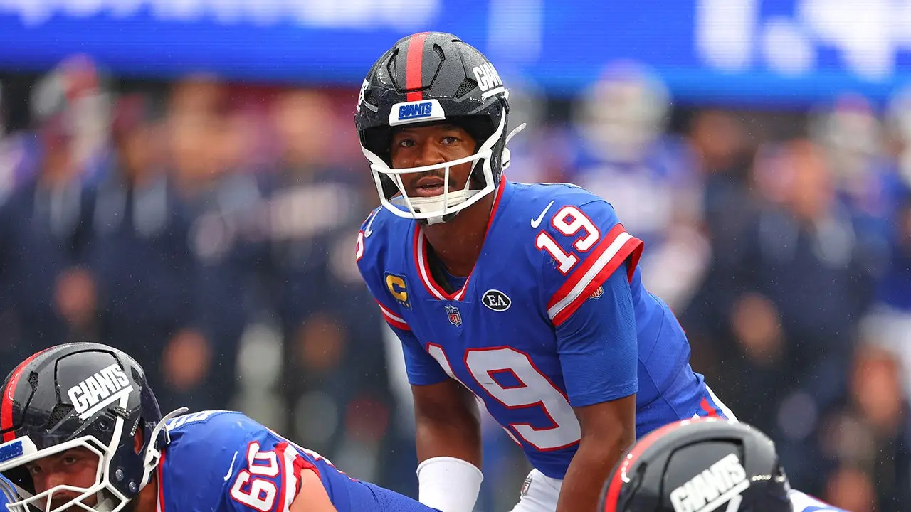 Jameis Winston in New York Giants uniform celebrating on field during game