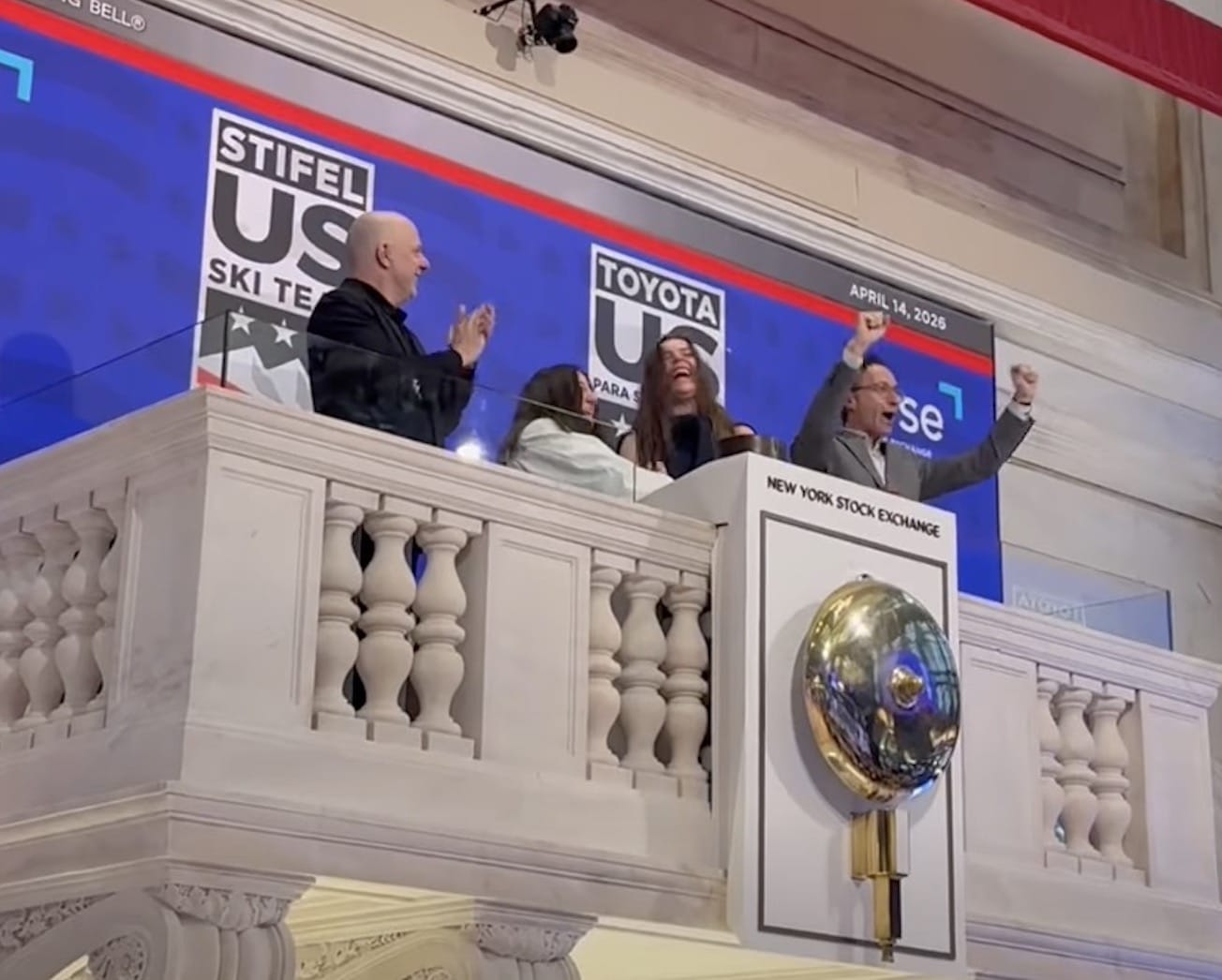 Two Olympic gold medalists in Team USA gear ringing opening bell at New York Stock Exchange