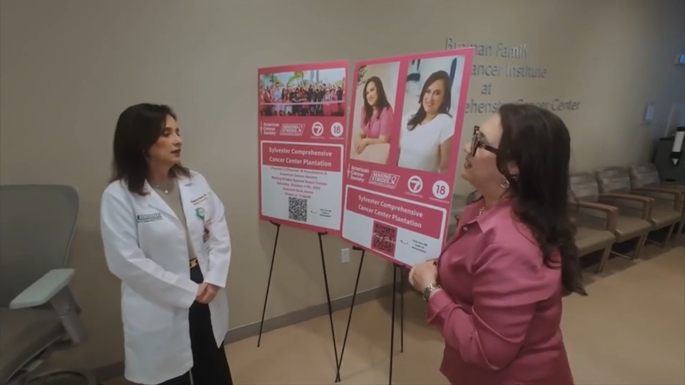 Maria Velez smiling with her medical team at American Cancer Society event