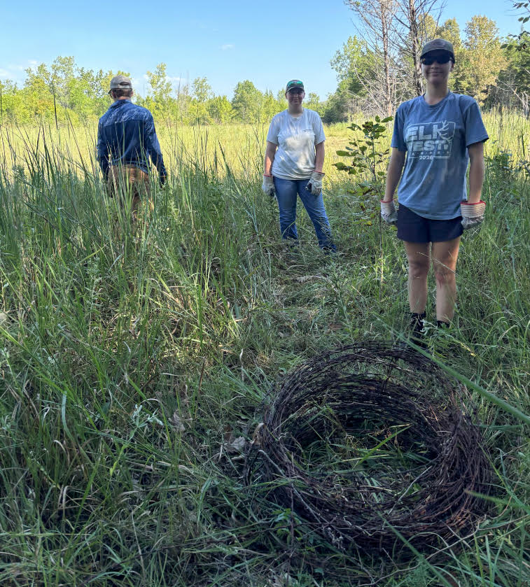 Volunteers clearing fallen branches and debris from boat lanes at Arkansas wildlife area