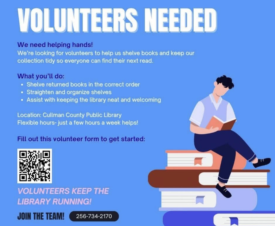 Volunteers organizing books on library shelves in Cullman County Public Library System