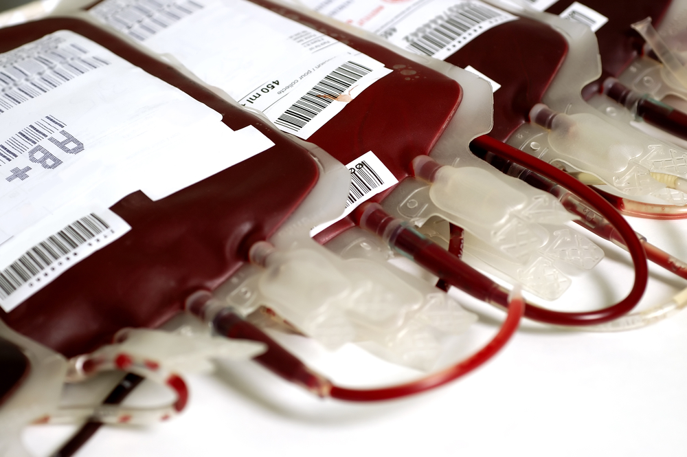 Diverse hands joining together symbolizing community blood and organ donation solidarity
