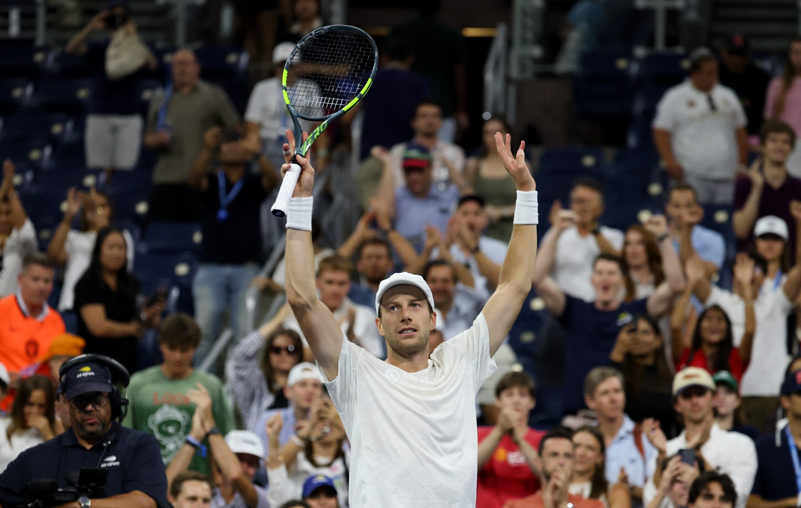 Botic van de Zandschulp celebrating victory with arms raised after five-hour comeback match
