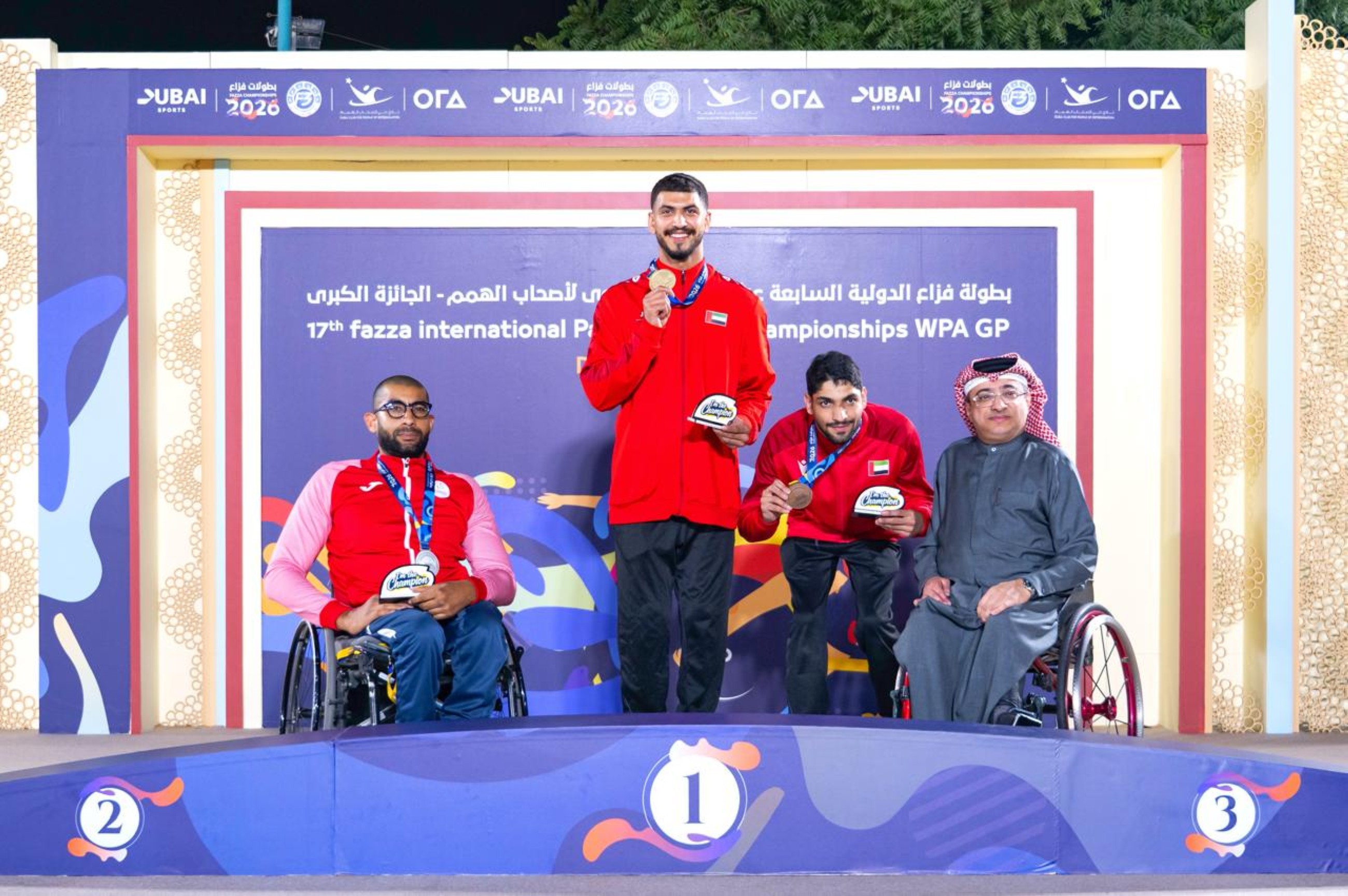 Mohammed Youssef Othman celebrates on podium holding gold medal at Dubai para athletics championship
