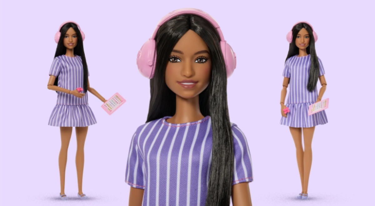 Autistic Barbie doll wearing sensory-friendly clothing with noise-canceling headphones and fidget spinner accessories