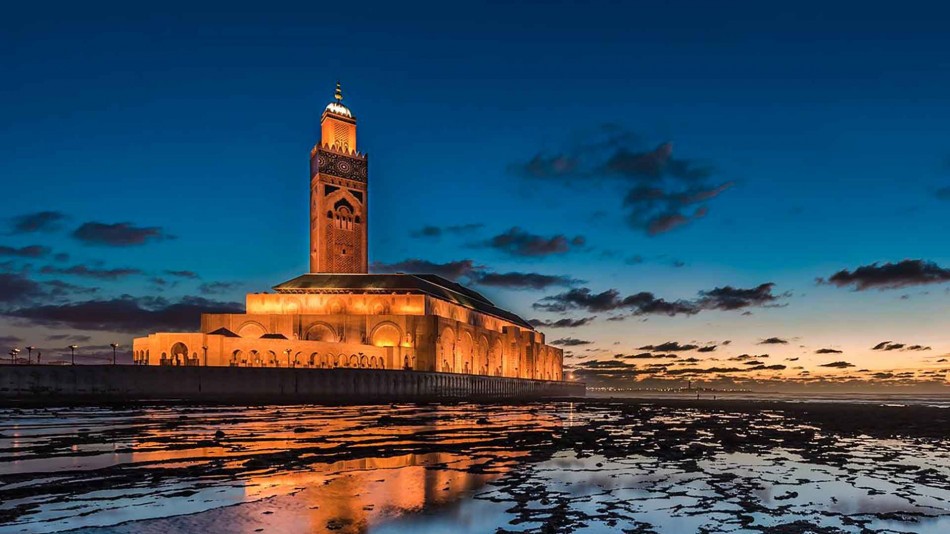 Exterior view of a restored Moroccan mosque with traditional architecture and minaret