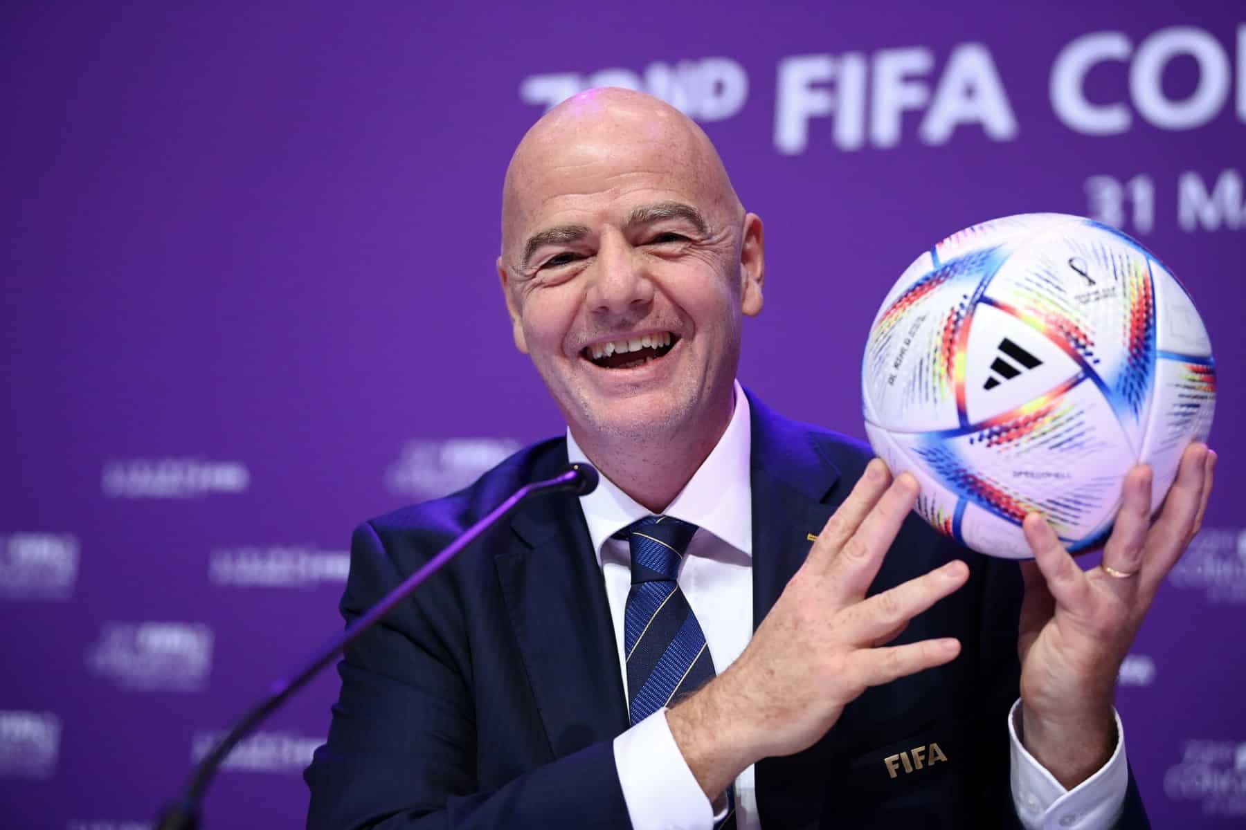Soccer referee holding up hand signaling countdown timer during professional football match