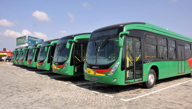 Aayalolo public buses lined up at transit terminal in Accra, Ghana ready for passenger service