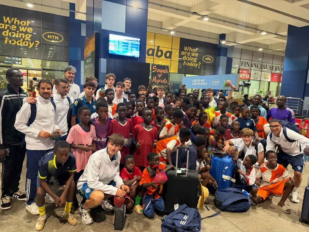 Como 1907 academy coaches working with young Ghanaian football players on training field