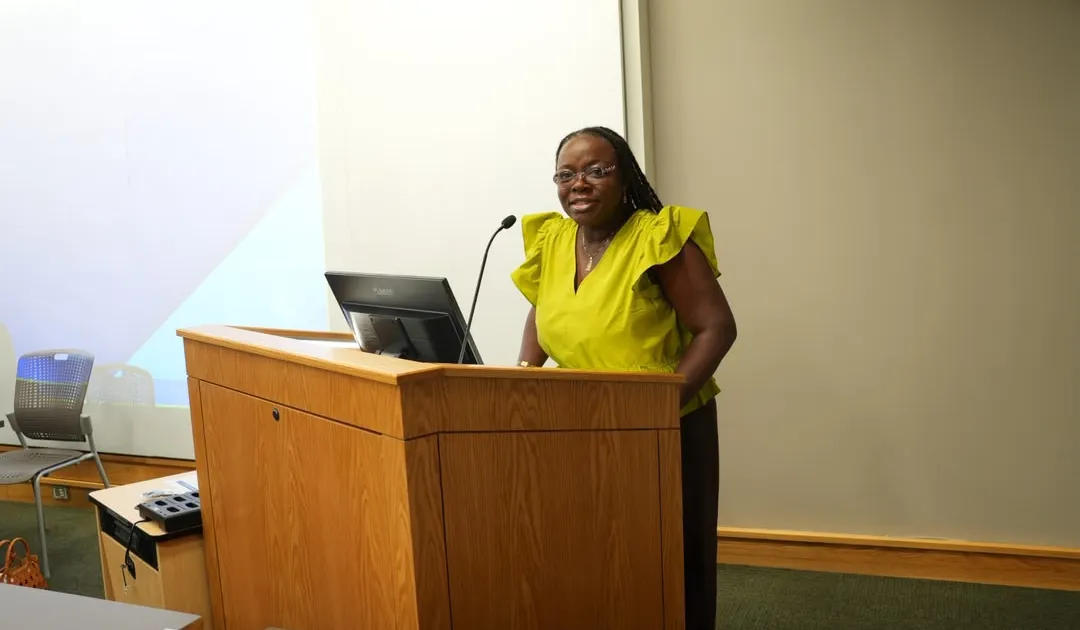 Professor Nana Aba Appiah Amfo speaking at university event about research funding in Ghana