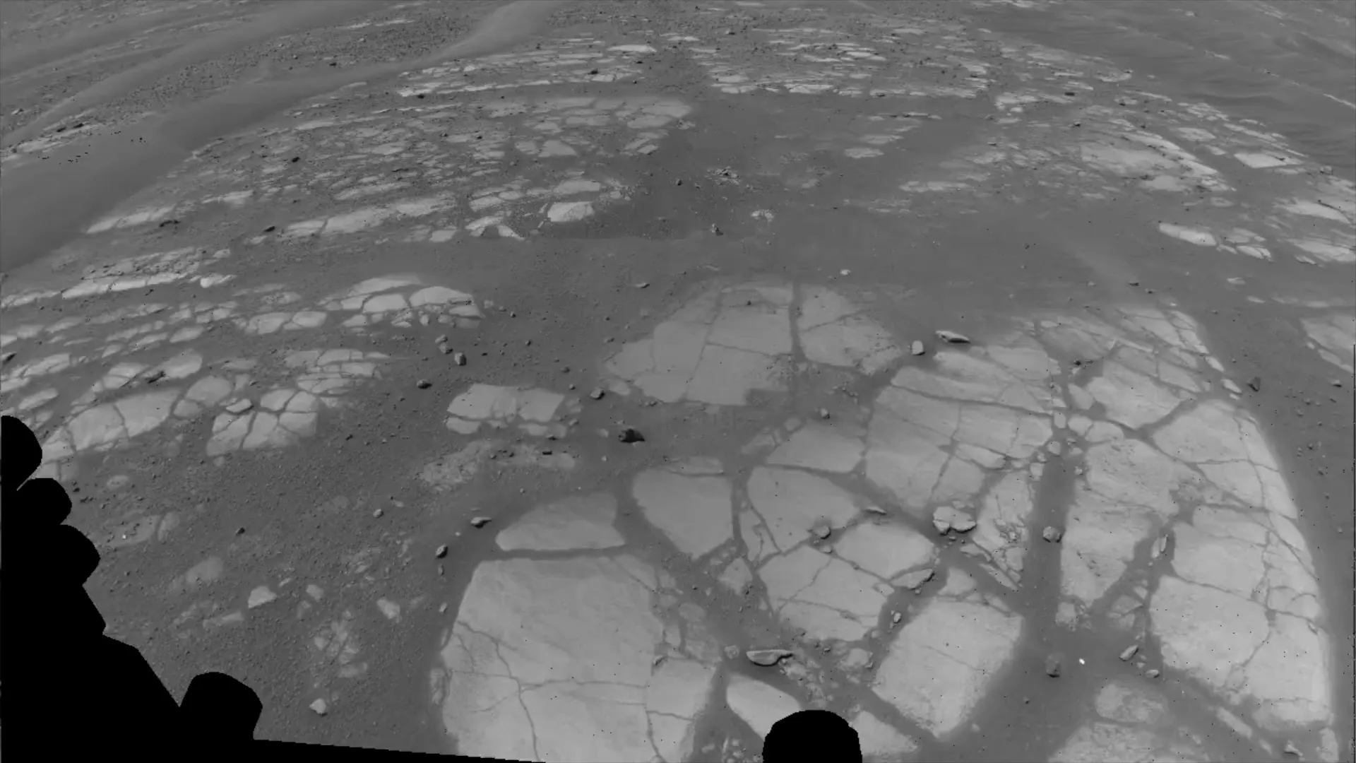 NASA Perseverance rover driving along Jezero Crater rim on Mars with AI-planned route