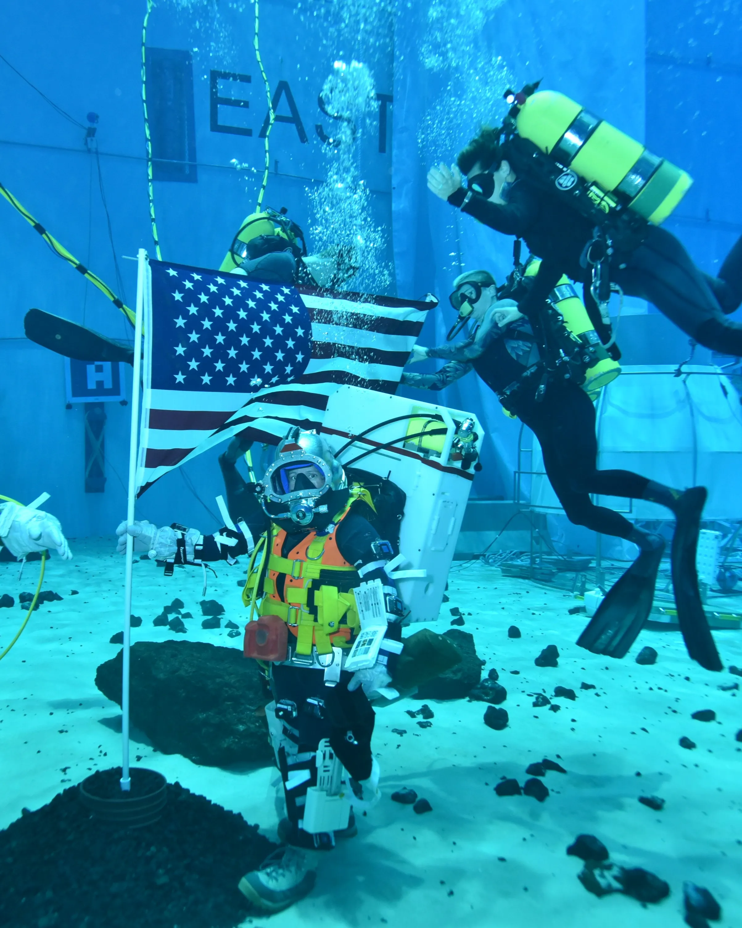 NASA engineer Jaclyn Kagey training underwater in full spacesuit at Johnson Space Center