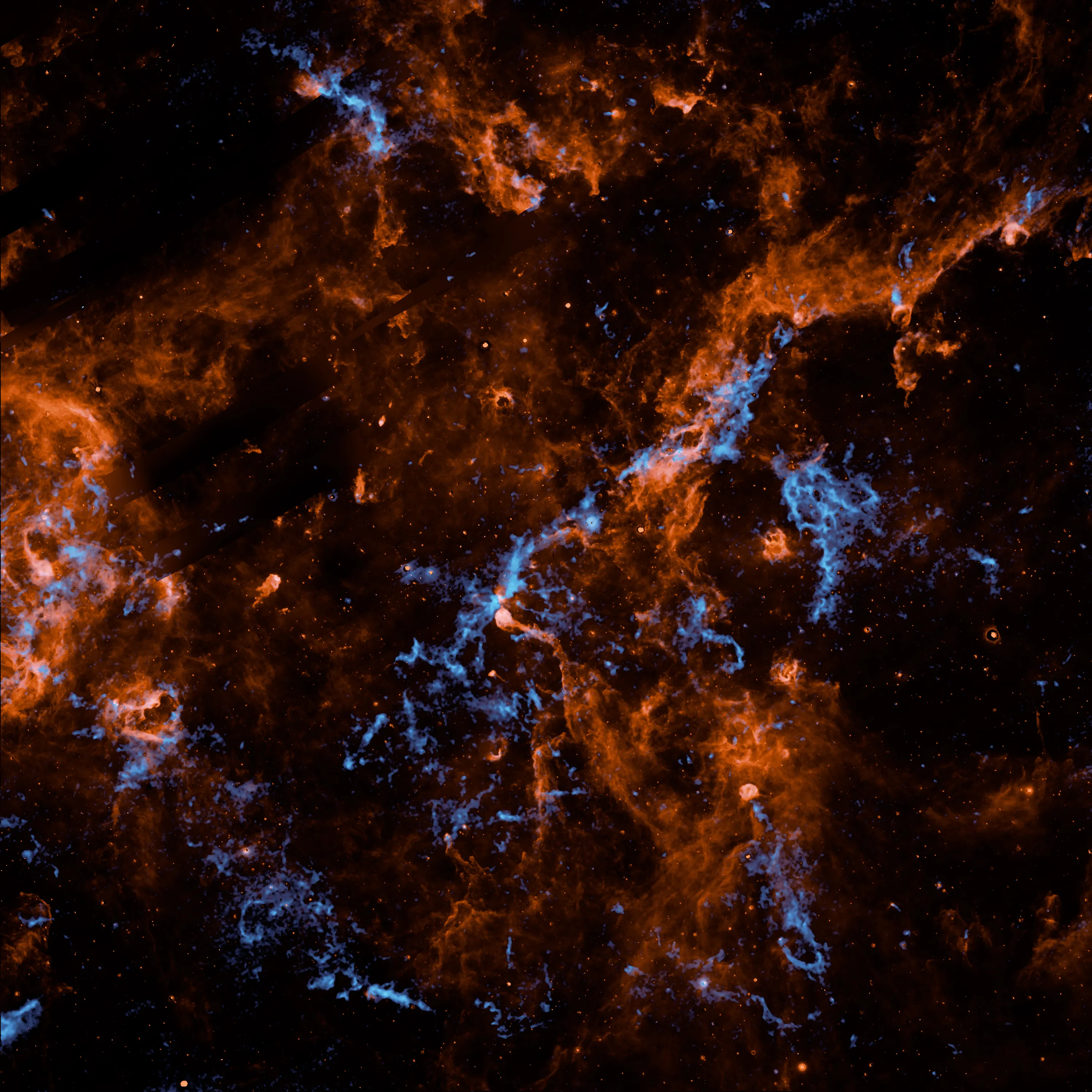 NASA SPHEREx image showing bright blue water ice and orange hydrocarbons in Cygnus X star region