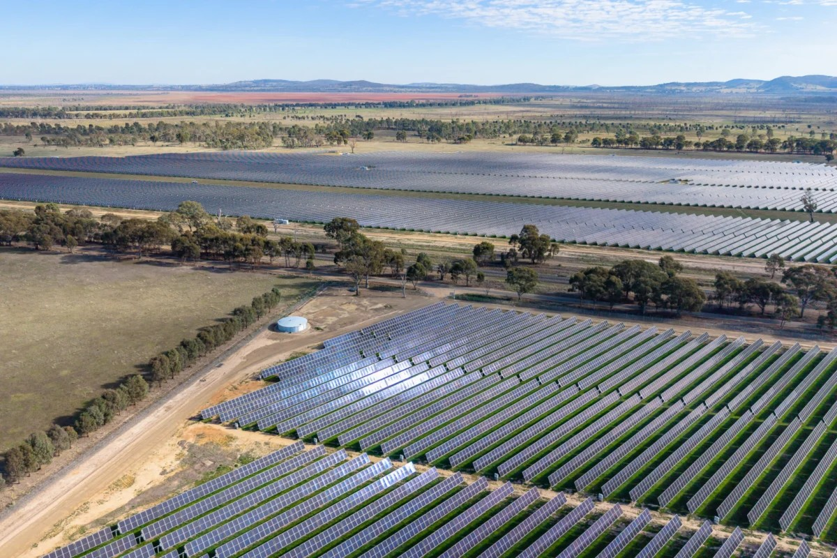 Solar panels on Australian rooftops with battery storage units installed beside homes