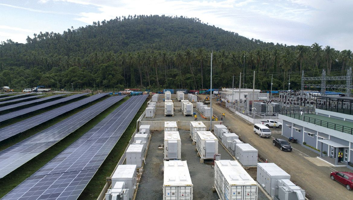 Large solar panel array with battery storage facility under bright Philippine sunshine