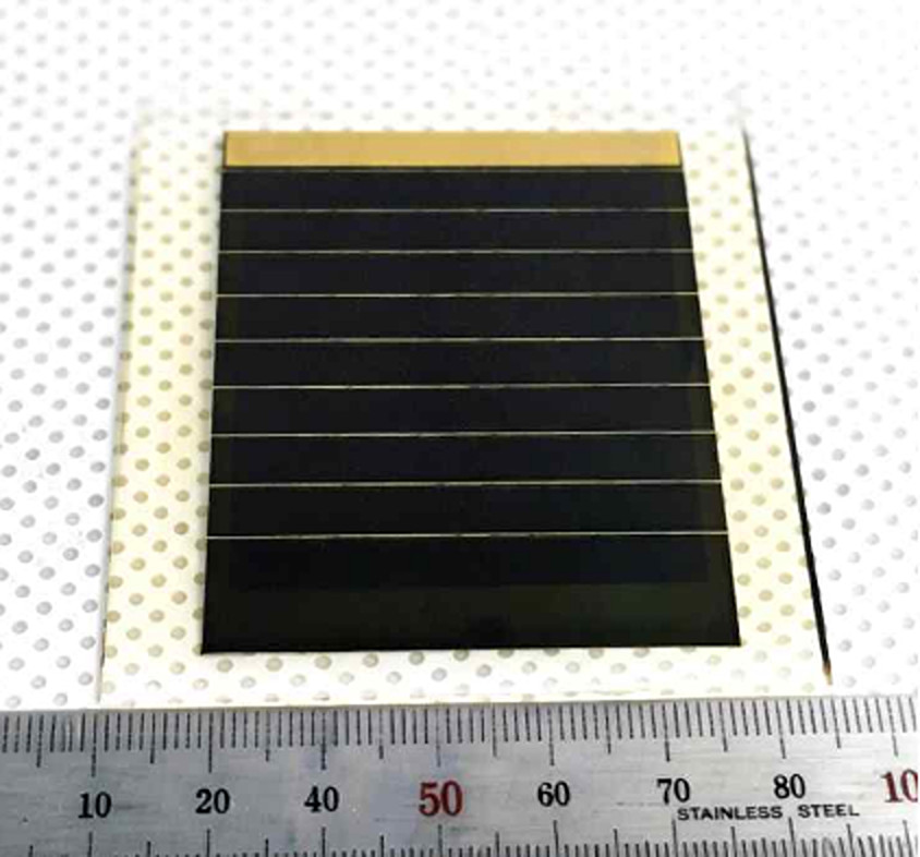 Close-up of perovskite solar panel module reflecting light in laboratory setting