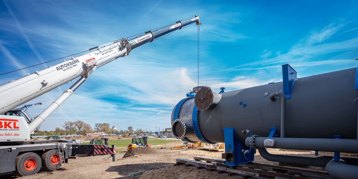 Large industrial heat pump components being installed at wastewater treatment facility in Hanover Germany
