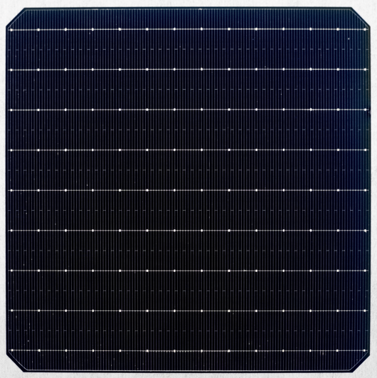 Close-up view of solar cell with copper contacts showing reflective surface and metallic grid pattern