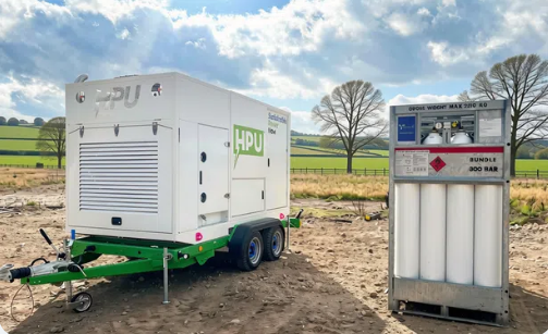 Compact trailer-mounted hydrogen generator parked at construction site producing clean power