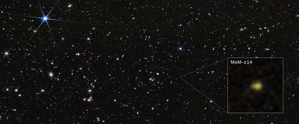 NASA's James Webb Space Telescope image showing distant galaxy MoM-z14 as reddish glow against black space