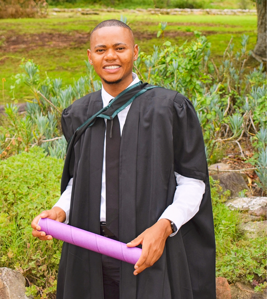 Khangelani Dlamini in graduation cap and gown at Rhodes University, South Africa