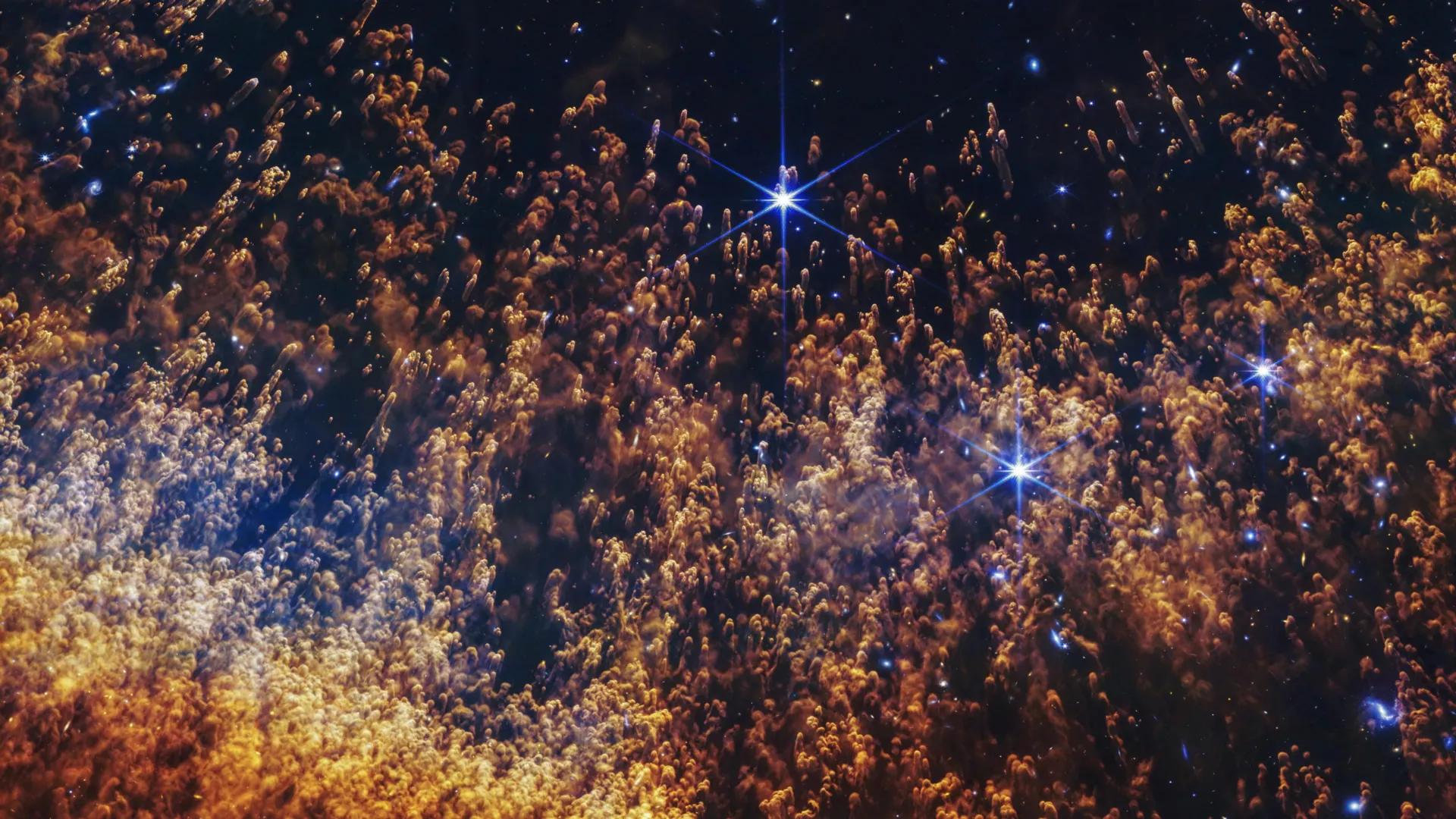 Webb telescope infrared view of Helix Nebula showing colorful gas clouds around dying star