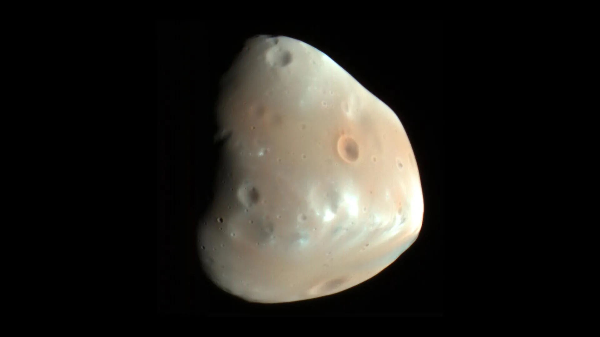 One Asteroid Strike Solved Two Mysteries on Mars Moon
