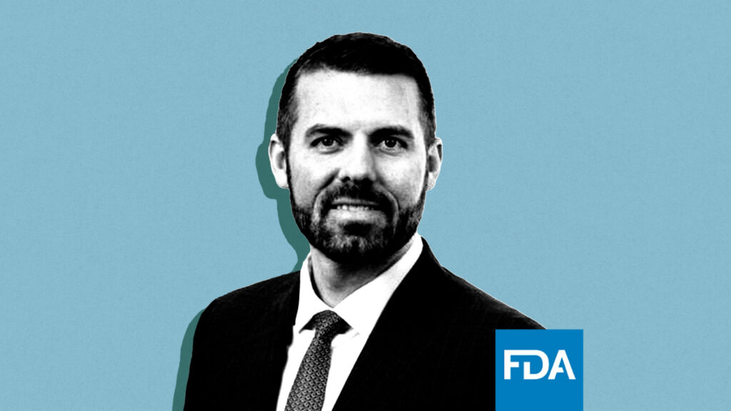 ** Kyle Diamantas standing in professional attire at FDA headquarters in Washington