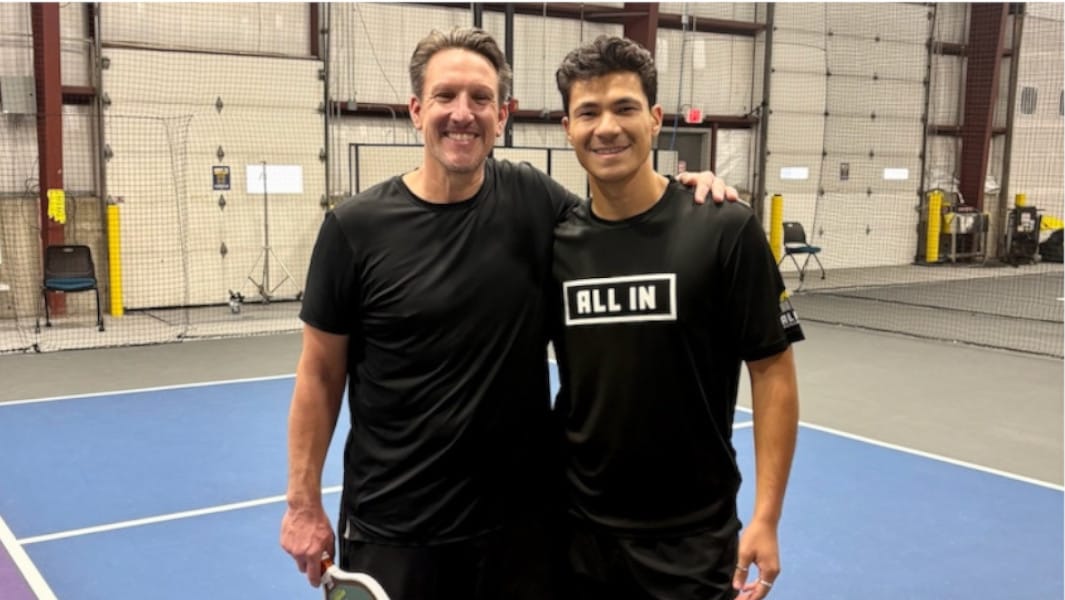 Two pickleball players on indoor court during their 28-hour marathon world record attempt